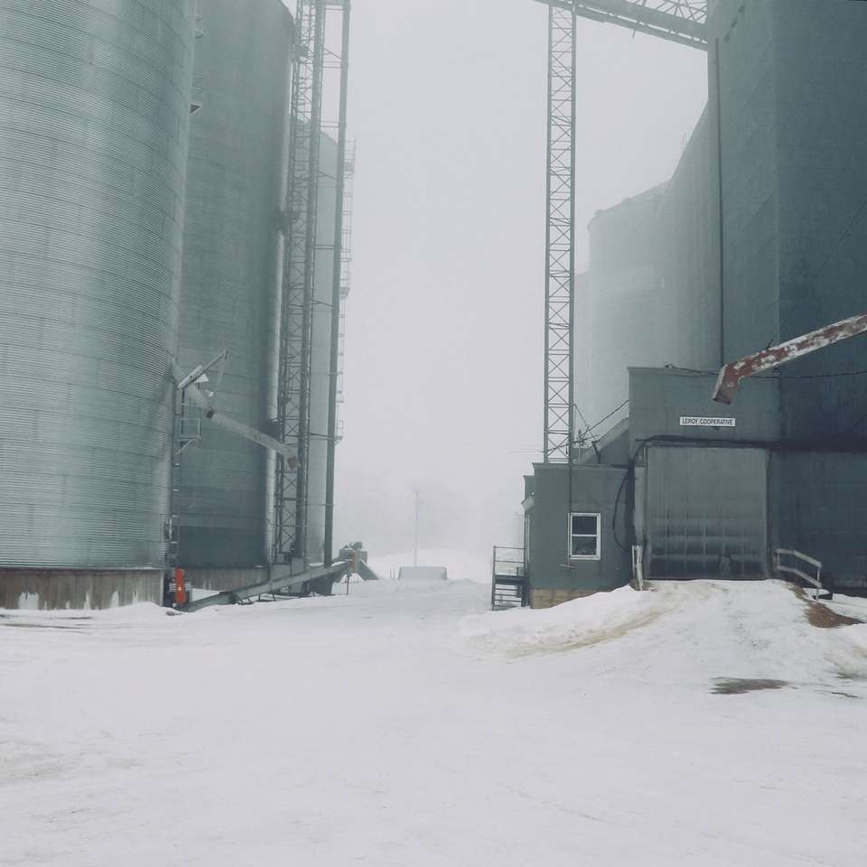 gray metal silos during winter sliding puzzle online