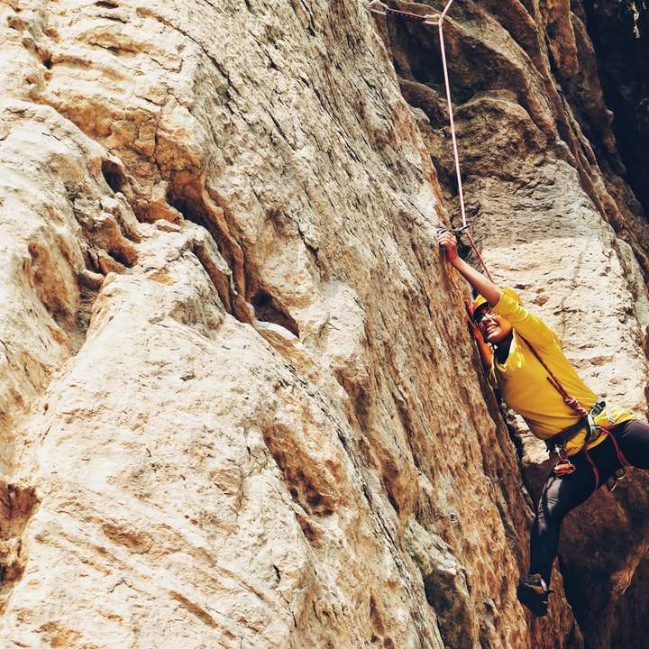 person climbing on the rock online puzzle