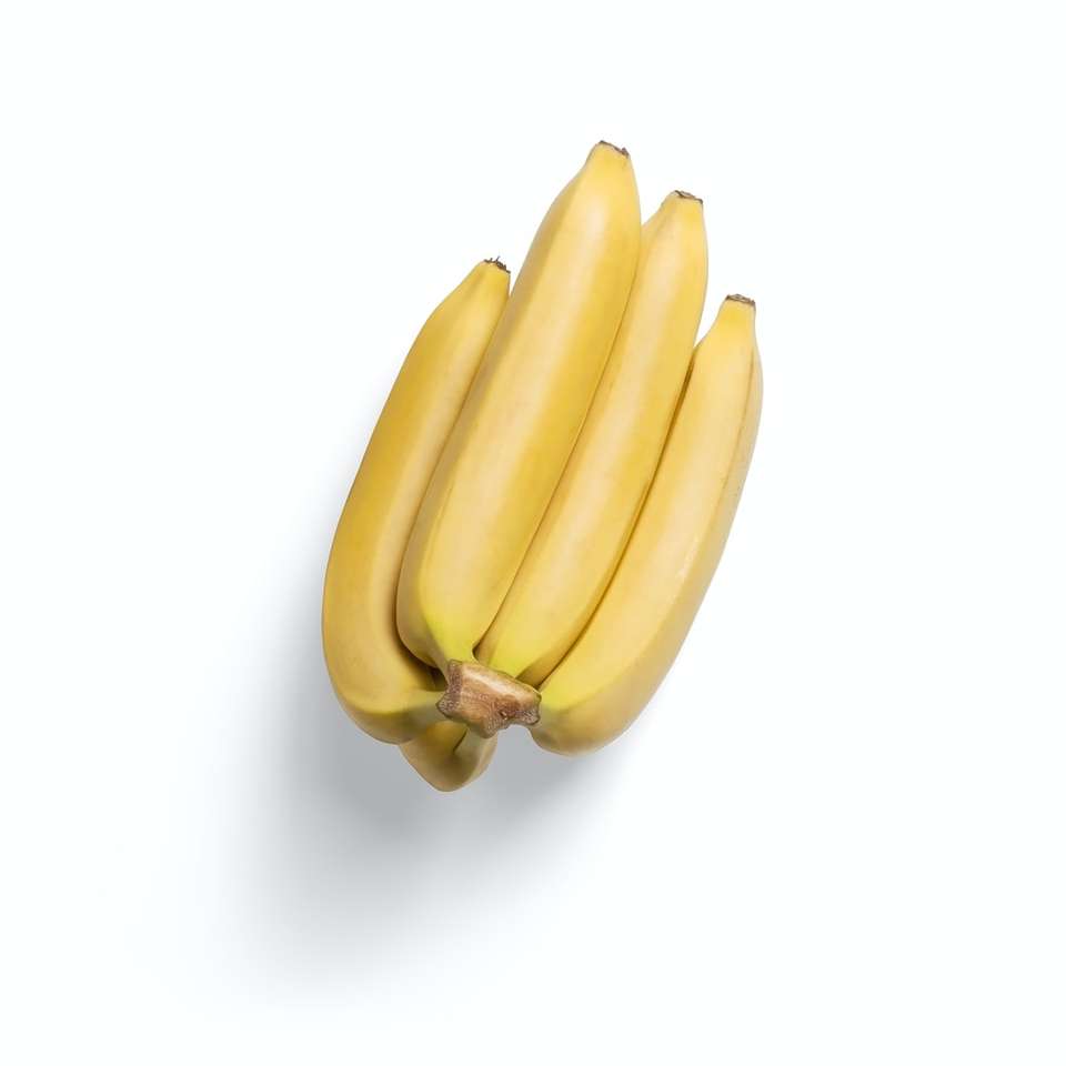 3 gula bananfrukter på vit yta glidande pussel online