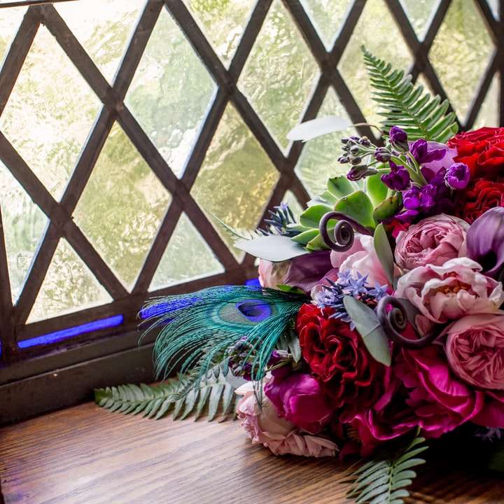 multicolored bouquet beside window sliding puzzle online