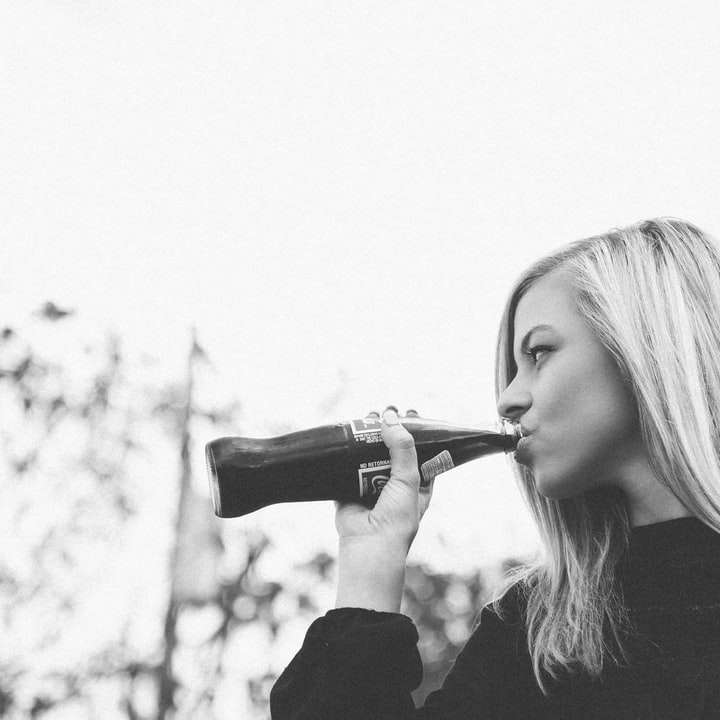 blonde woman drinks cola sliding puzzle online