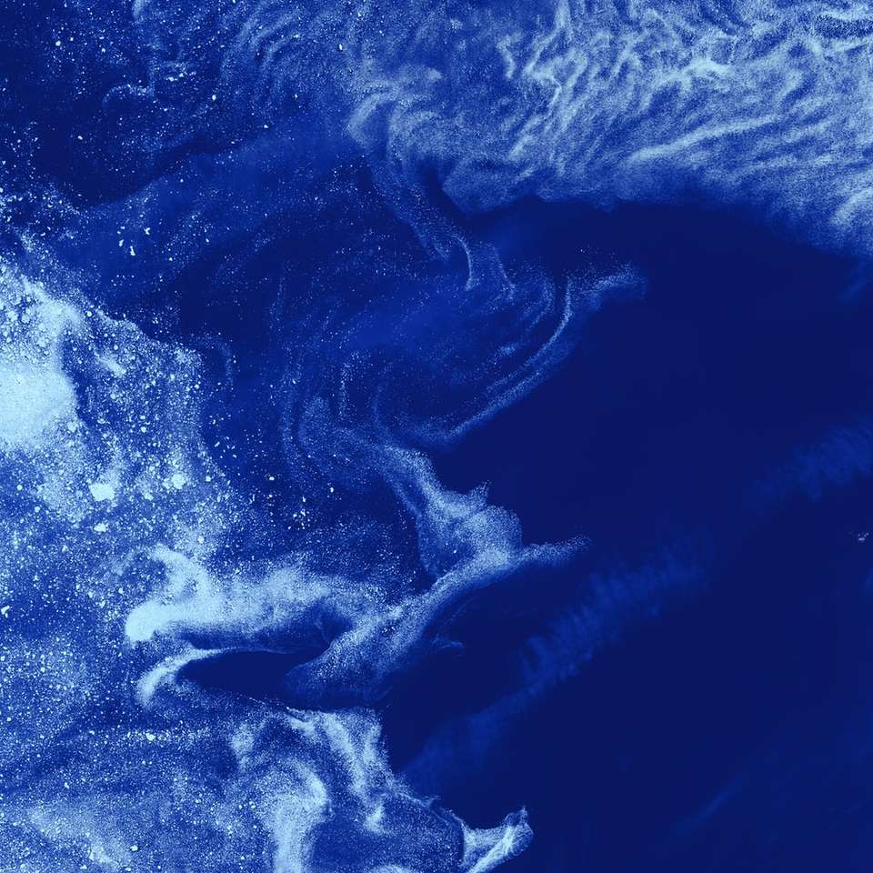 μπλε και άσπρα κύματα του ωκεανού συρόμενο παζλ online
