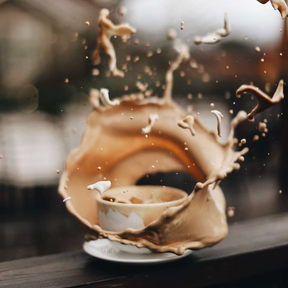 white ceramic teacup with brown liquid online puzzle