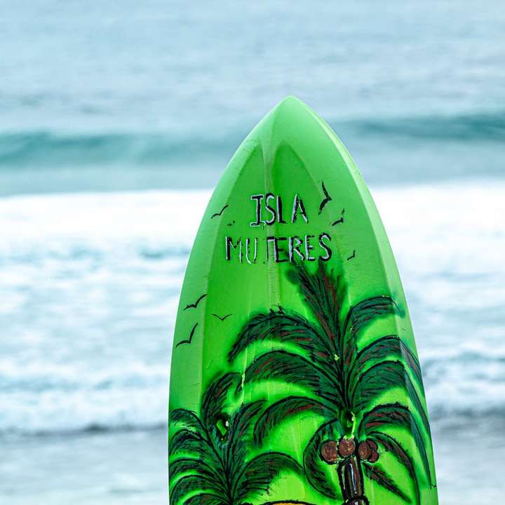 green Isla Muteres surfboard during daytime sliding puzzle online