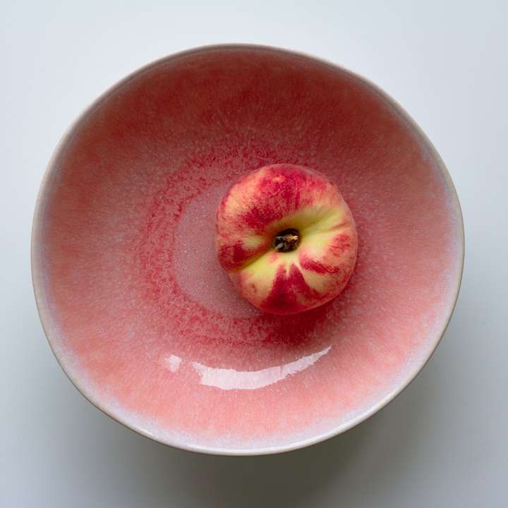 Perzik in een roze kom schuifpuzzel online