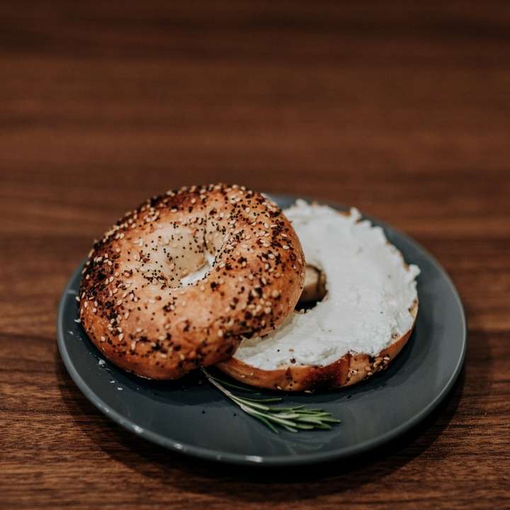 bread with white cream on black round plate online puzzle