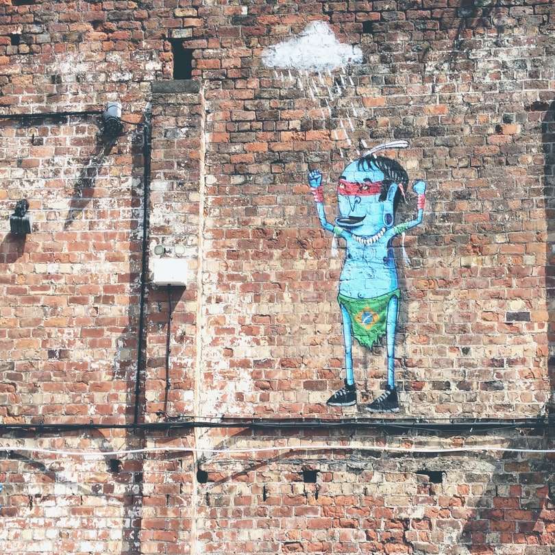 Мультфильм произведение искусства на кирпичной стене онлайн-пазл