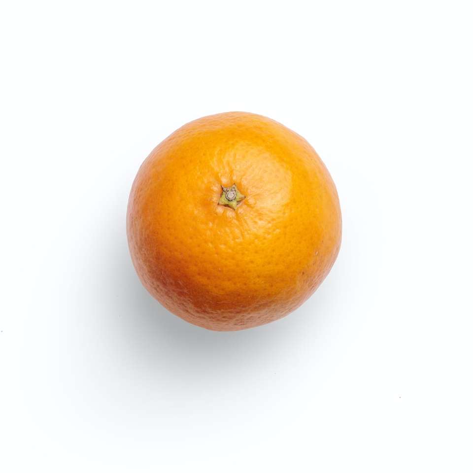 портокалов плод върху бяла повърхност онлайн пъзел