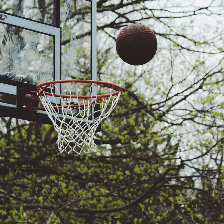 Basketball over a hoop sliding puzzle online