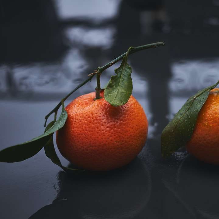dos frutas naranjas redondas puzzle deslizante online