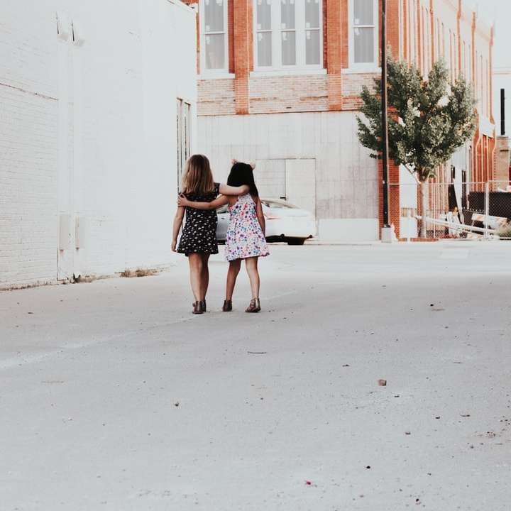 two girls walking on street online puzzle
