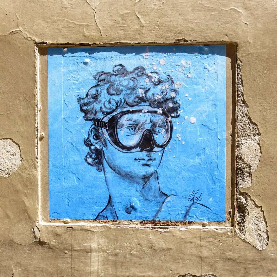 Malen auf Person mit Schutzbrille Schiebepuzzle online