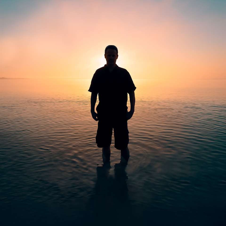 man standing on body of water online puzzle