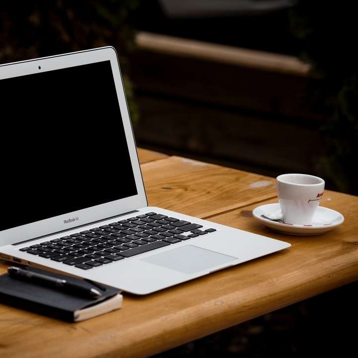 macbook laptop on a desk online puzzle