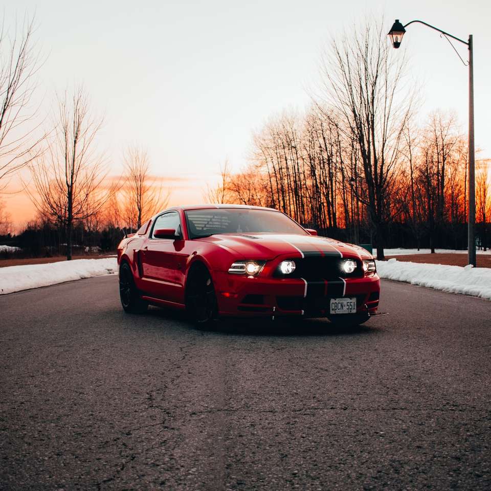 red bmw m 3 on road during daytime sliding puzzle online