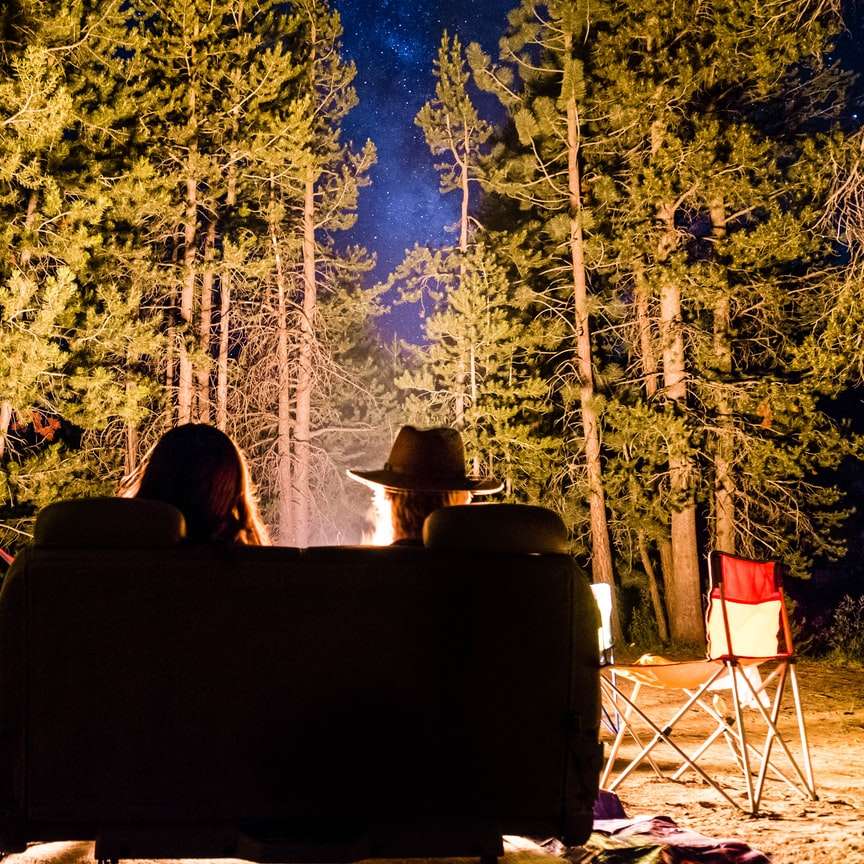 man and woman in front of campfire online puzzle