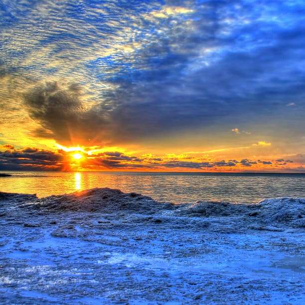 solnedgång över havet Pussel online