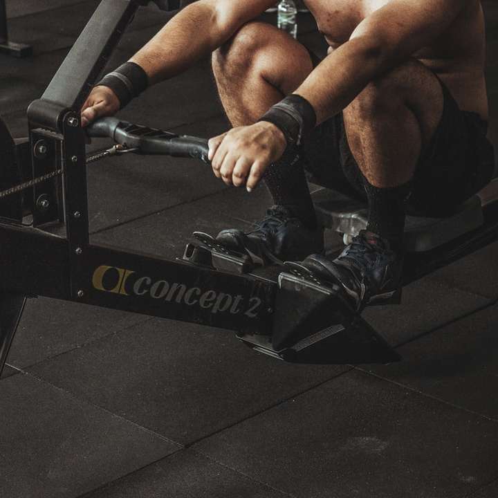 topless man using rowing machine sliding puzzle online