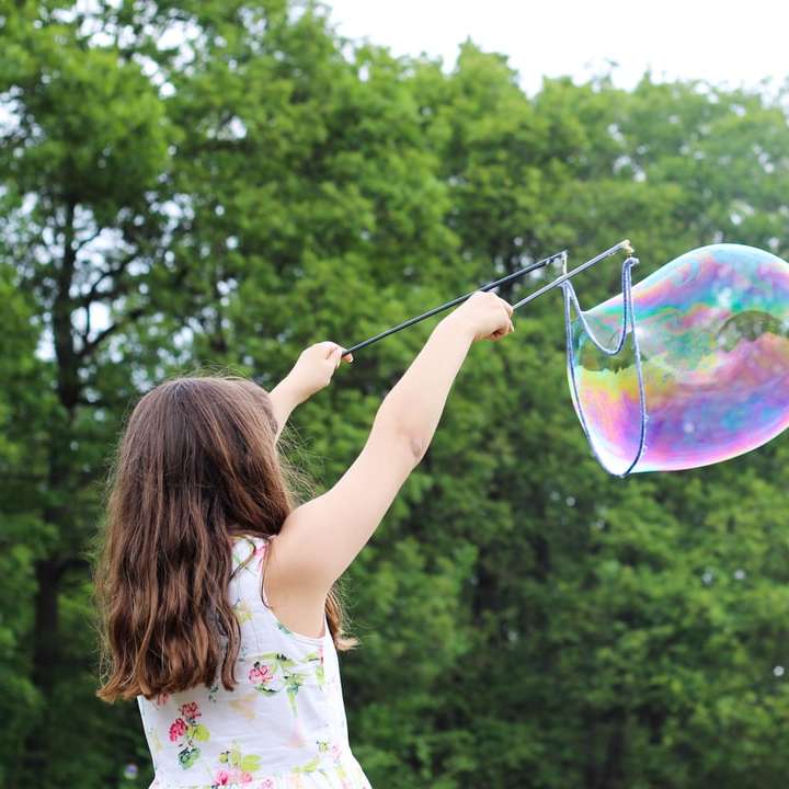 girl making bubbles during daytime sliding puzzle online