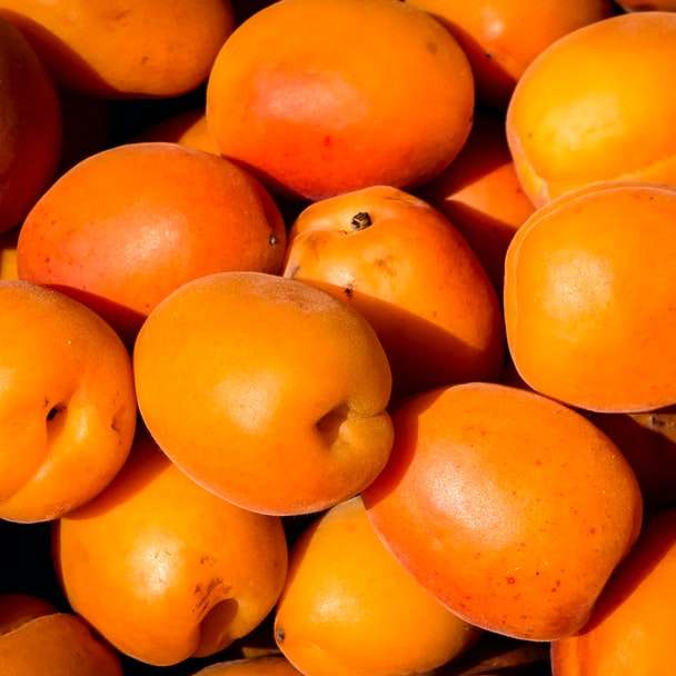 fotografia de foco raso de lote de fruta laranja puzzle online