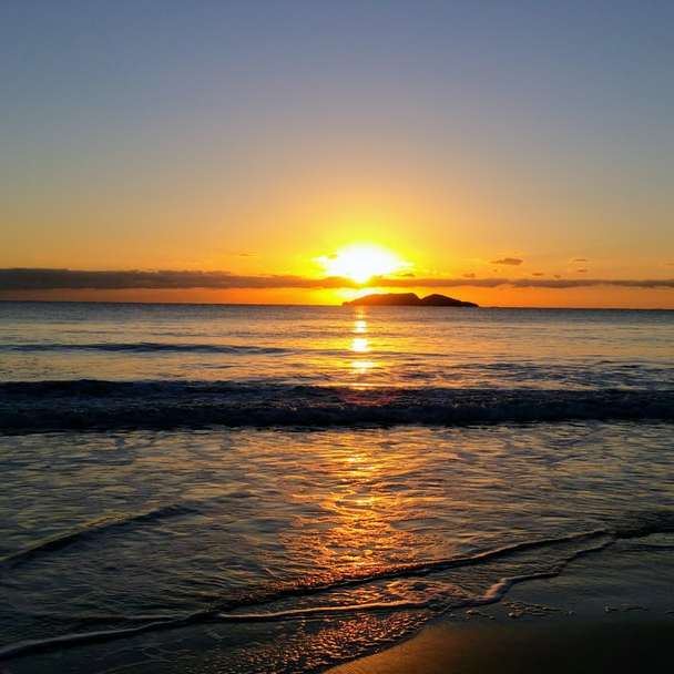 stranden vid solnedgången Pussel online
