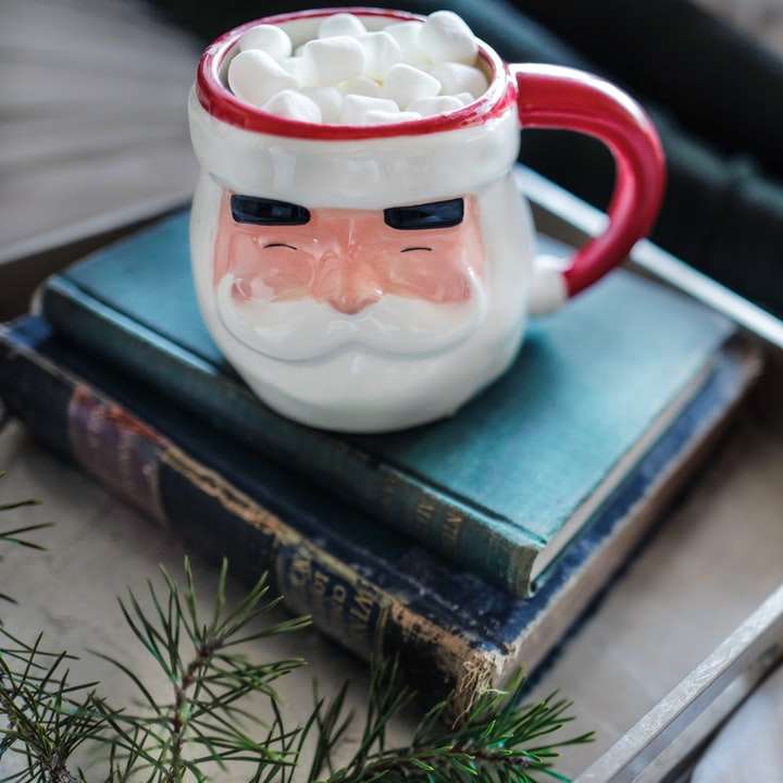 white and red ceramic mug on books online puzzle