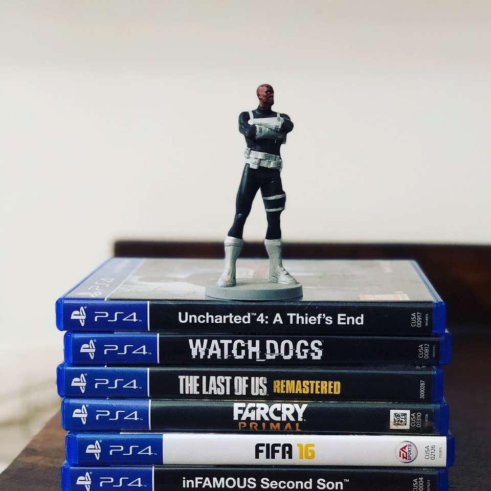 assorted-title Sony PS4 game cases with figurine on top sliding puzzle online