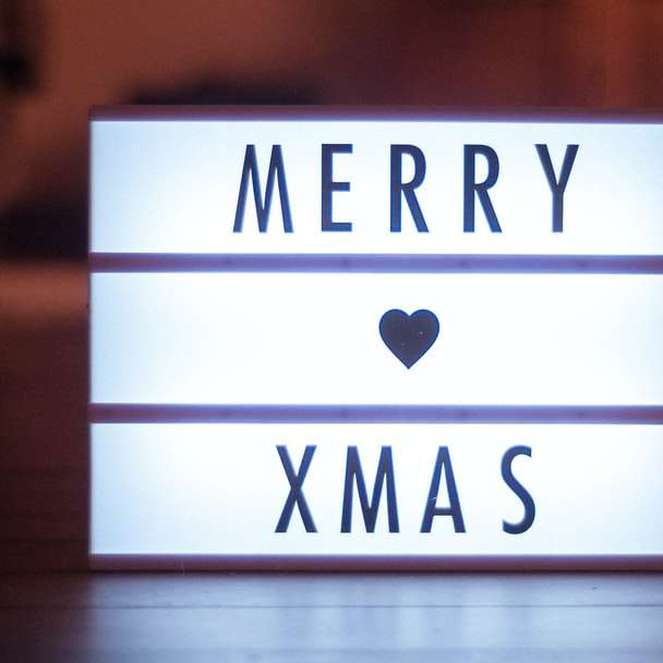 foto de foco superficial da sinalização LED do Merry Xmas puzzle deslizante online