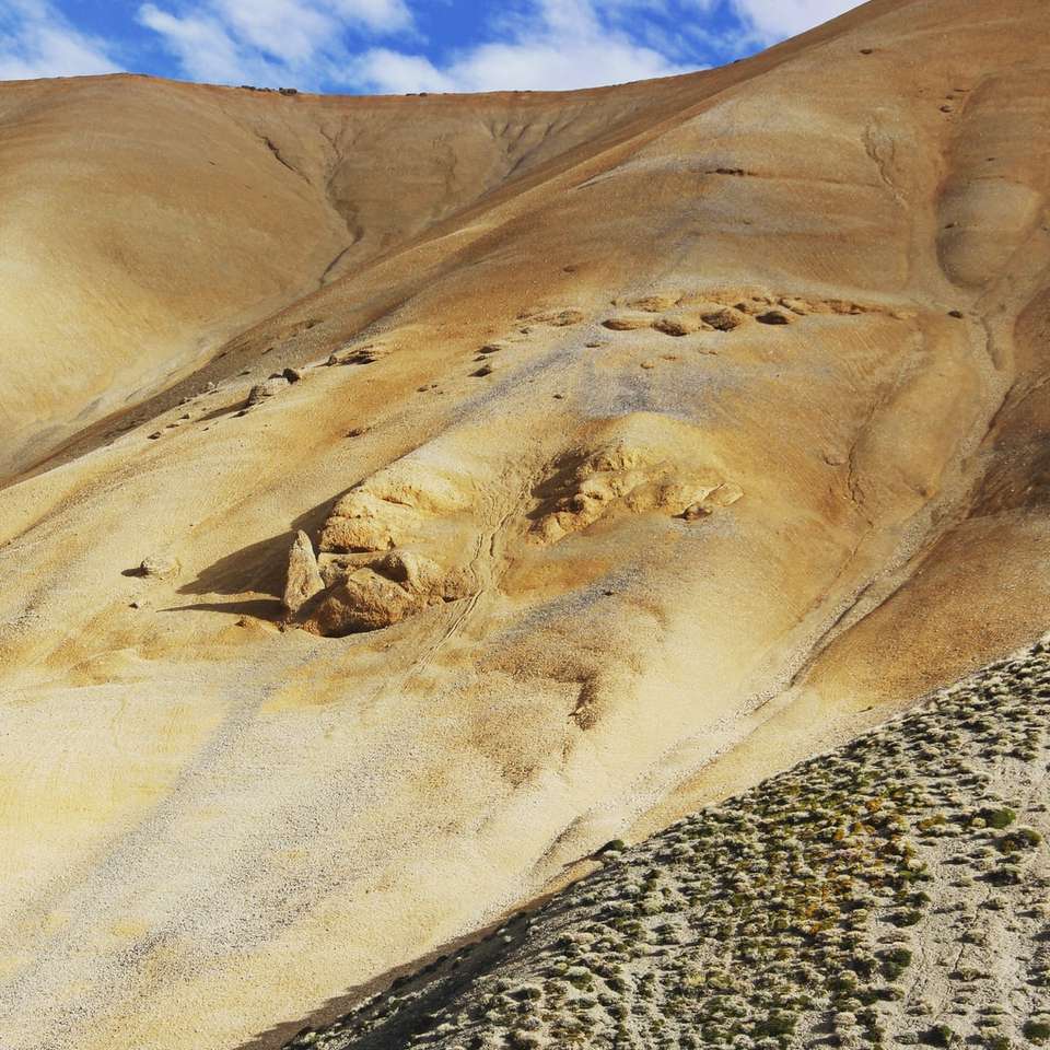 brown and white rock formation under blue sky during daytime online puzzle