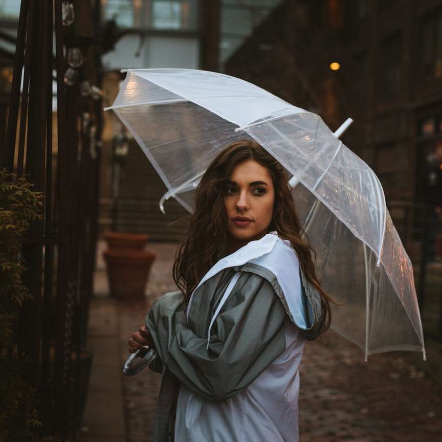 woman holding umbrella outdoor sliding puzzle online