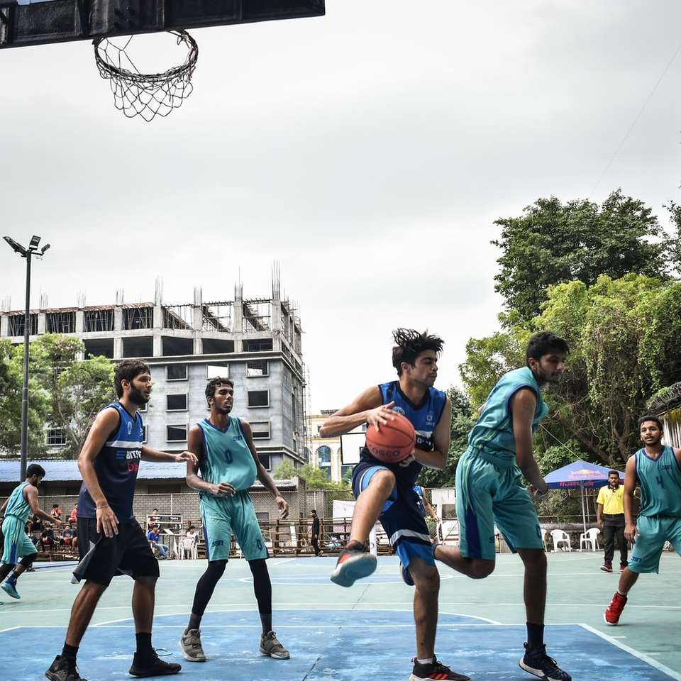 group of people playing basketball during daytime sliding puzzle online