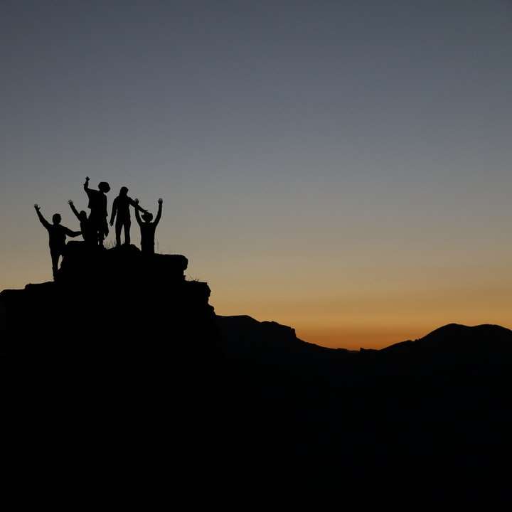 silhouette of people standing on highland sliding puzzle online