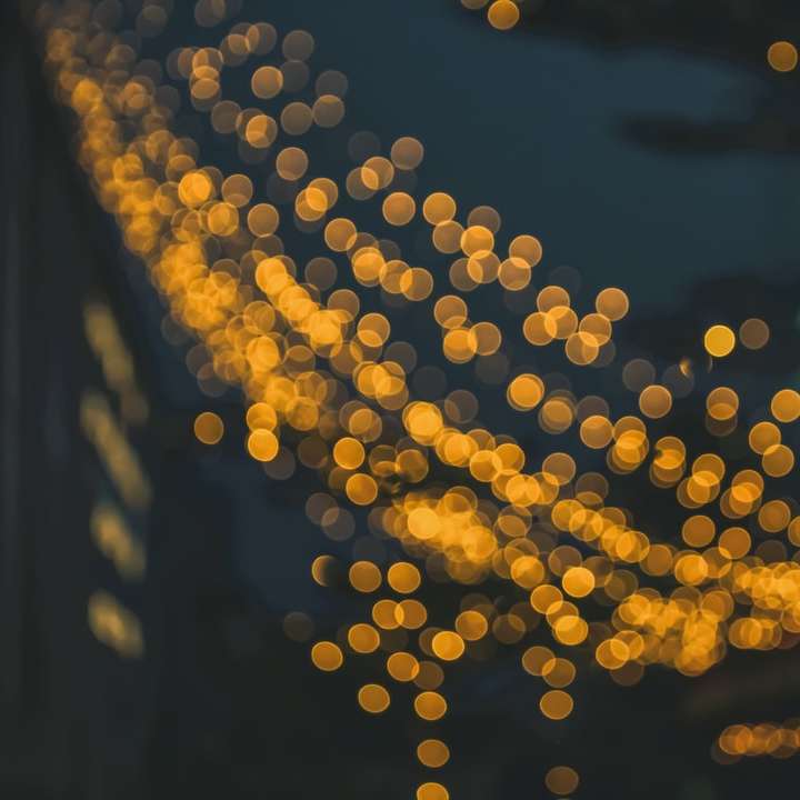 yellow and white bokeh lights sliding puzzle online