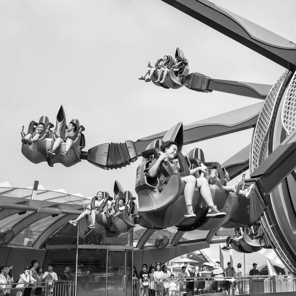 grayscale photo of people riding on a roller coaster online puzzle