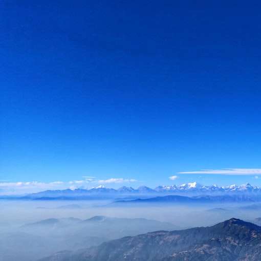 a légi felvétel a hegyek kék ég alatt nappali online puzzle