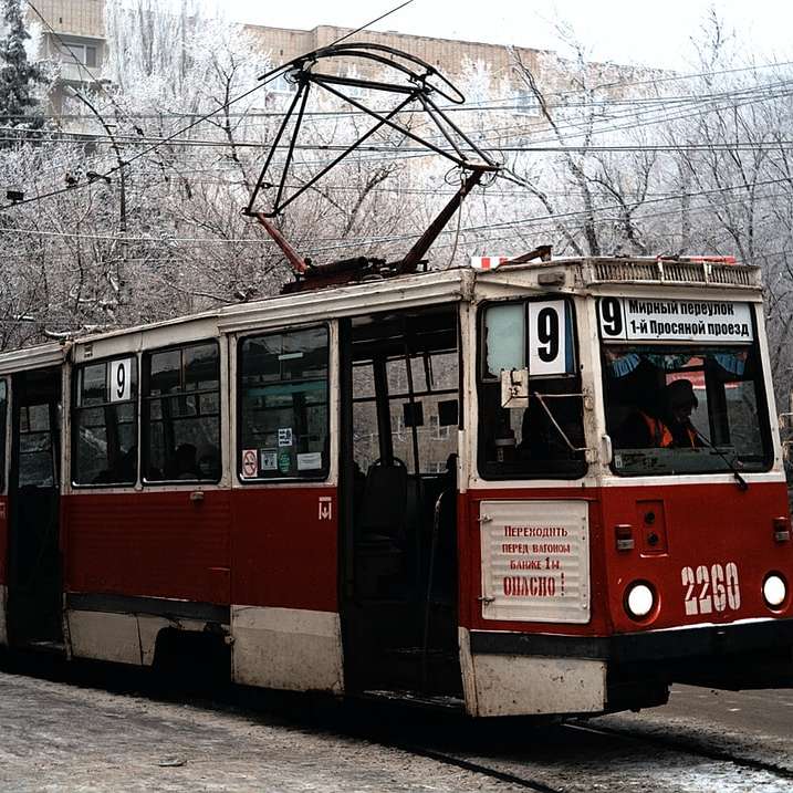 red and white tram on the road sliding puzzle online