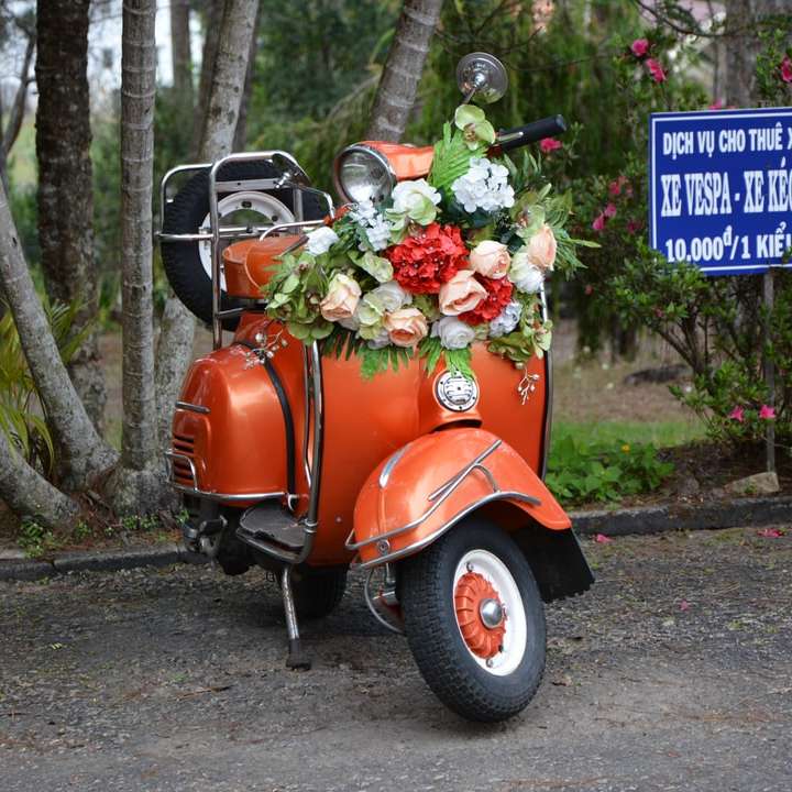 red and black motor scooter with flowers on top sliding puzzle online