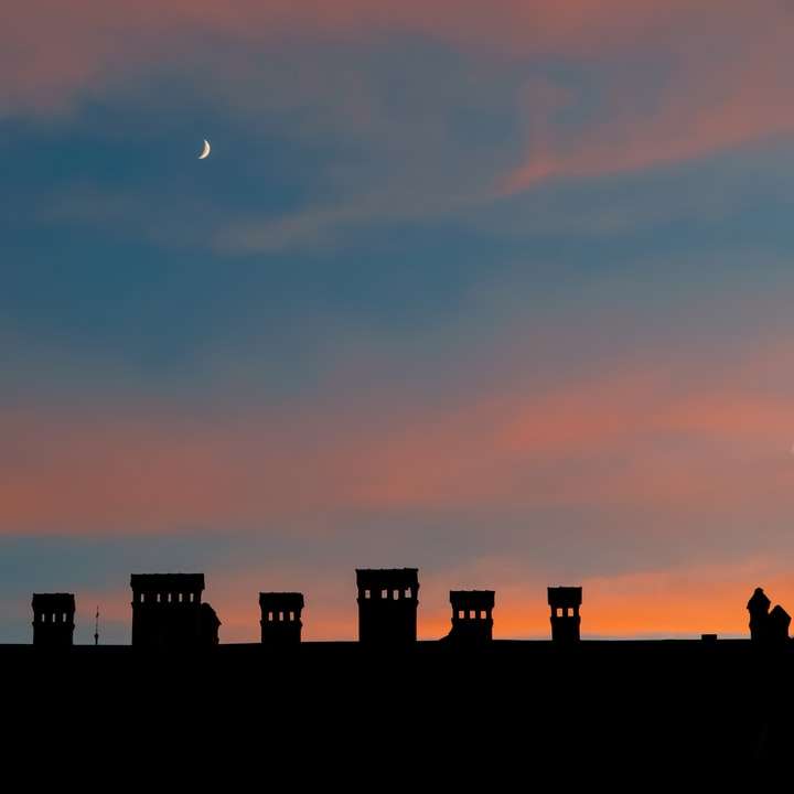 silueta de edificios de la ciudad durante la puesta de sol puzzle deslizante online