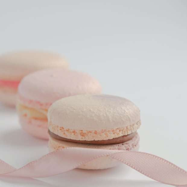 white and pink macaroons on white surface sliding puzzle online