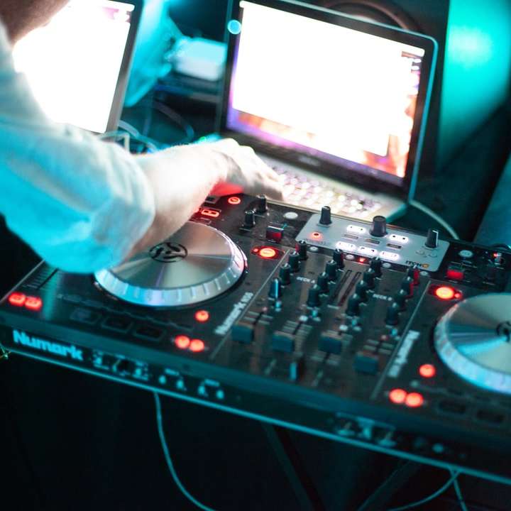 person playing dj controller with audio mixer online puzzle