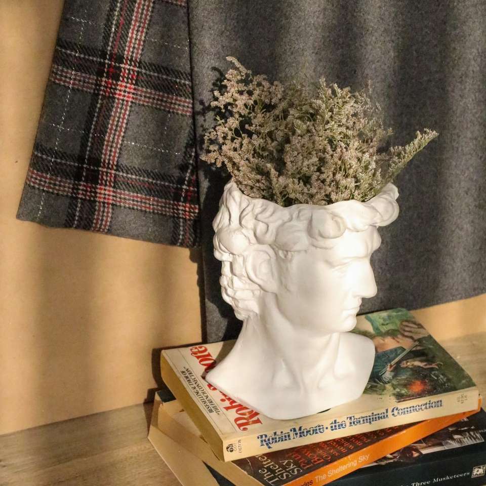 white ceramic vase with green plant sliding puzzle online