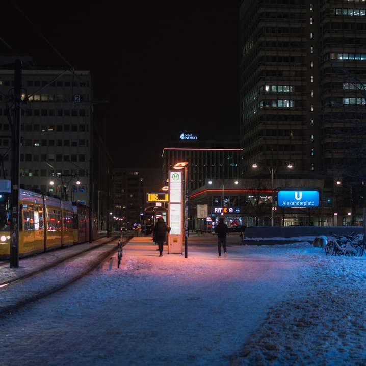 people walking on street during night time sliding puzzle online