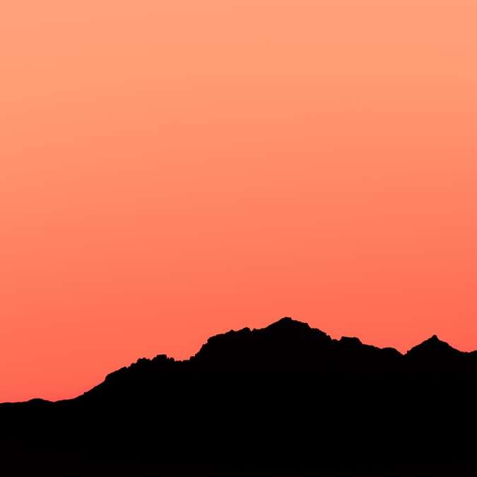 Schattenbild des Berges während des Sonnenuntergangs Schiebepuzzle online