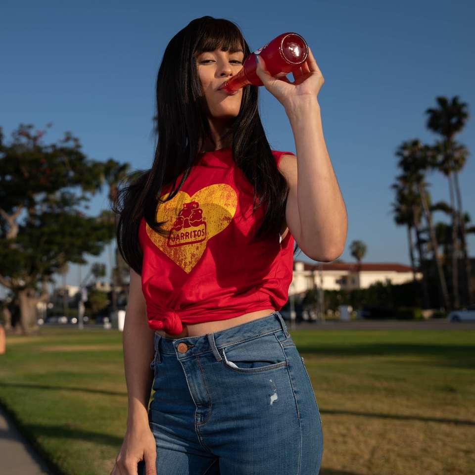 woman in red t-shirt and blue denim jeans sliding puzzle online