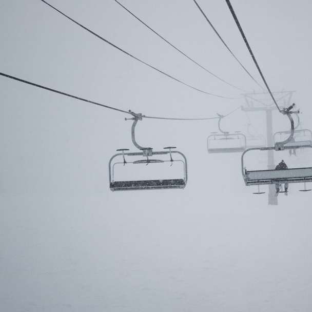white cable cars on white wall online puzzle