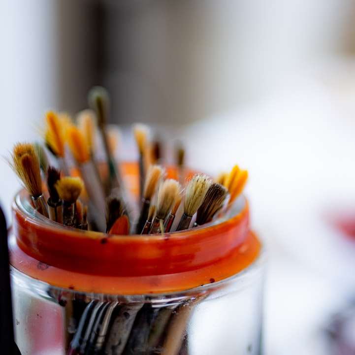 selective focus photography of paint brushes sliding puzzle online