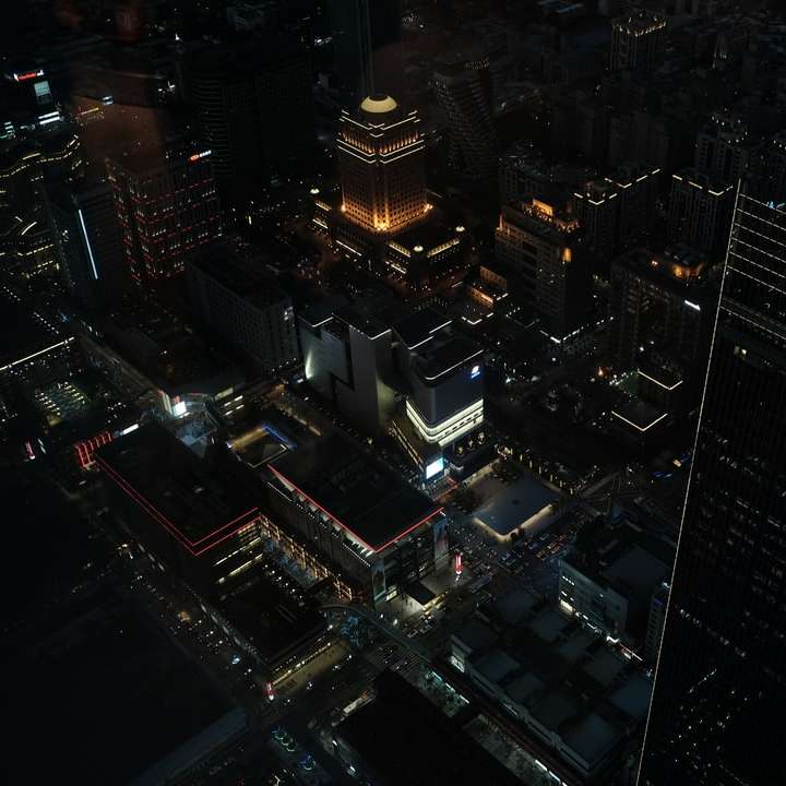 aerial view of city buildings during night time sliding puzzle online