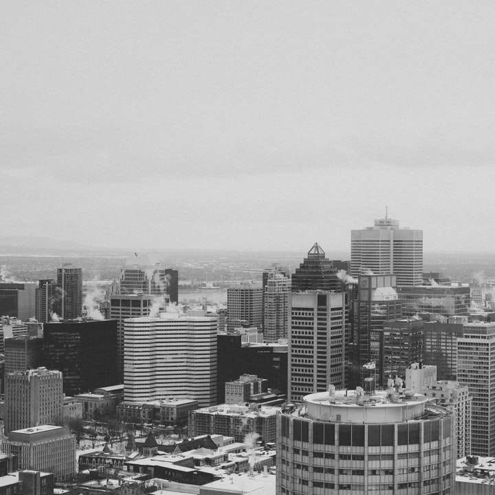 grayscale photo of city buildings during daytime sliding puzzle online
