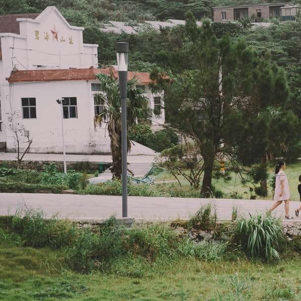 woman in white dress sitting on concrete bench online puzzle