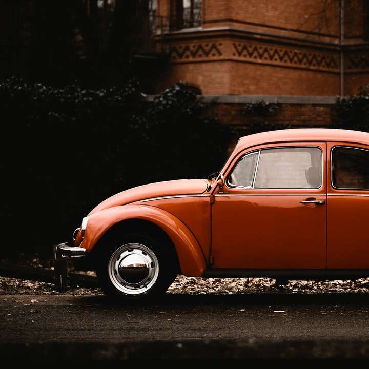 red vintage car on road sliding puzzle online